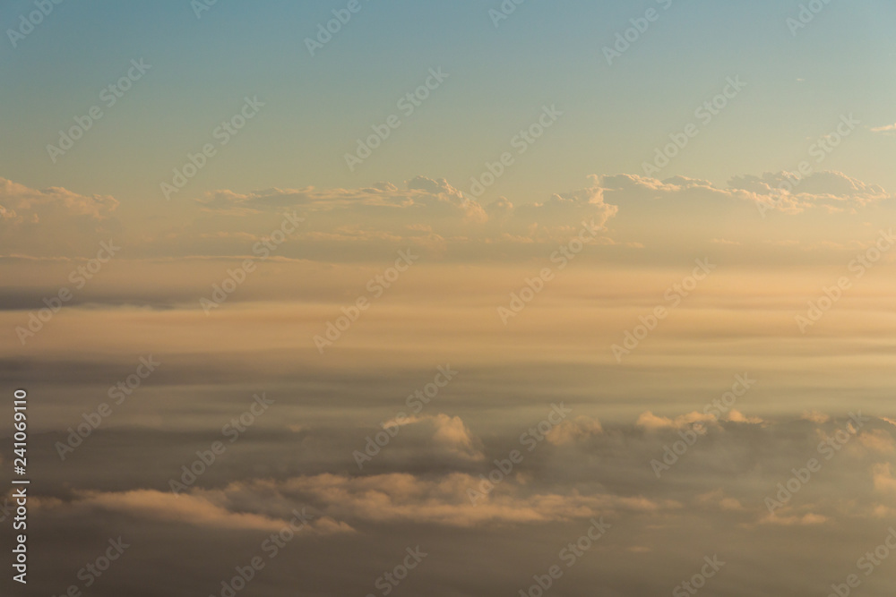 Fototapeta premium Low cloud lies over a warm landscape