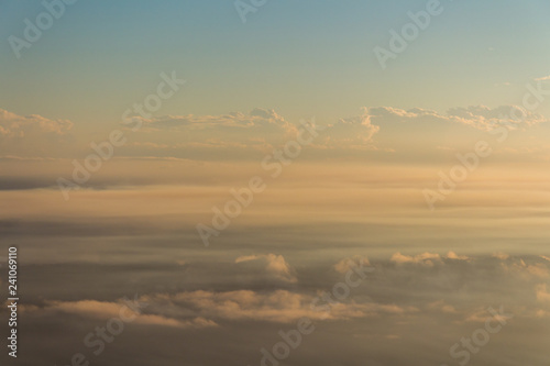 Low cloud lies over a warm landscape