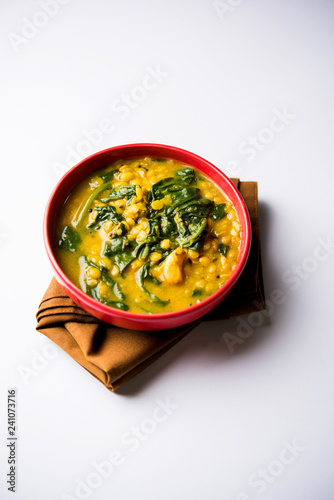 Dal Palak or Lentil spinach curry - popular Indian main course healthy recipe. served in a karahi/pan or bowl. selective focus photo