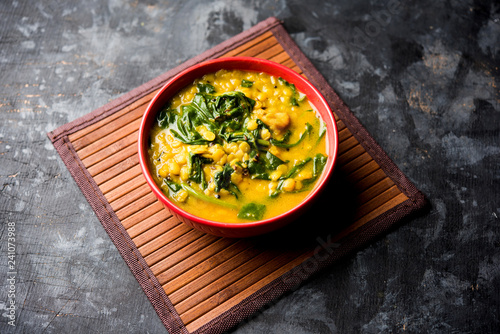 Dal Palak or Lentil spinach curry - popular Indian main course healthy recipe. served in a karahi/pan or bowl. selective focus photo