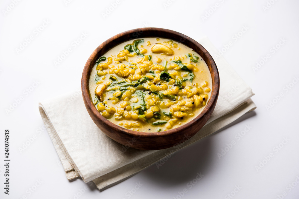 Dal Palak or Lentil spinach curry - popular Indian main course healthy recipe. served in a karahi/pan or bowl. selective focus Dal Palak or Lentil spinach curry - popular Indian main course healthy recipe. served in a karahi/pan or bowl. selective focus