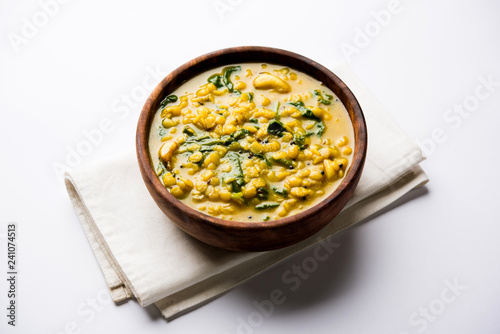 Dal Palak or Lentil spinach curry - popular Indian main course healthy recipe. served in a karahi/pan or bowl. selective focus