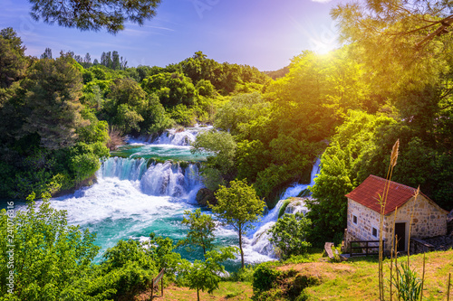 Waterfalls Krka, National Park, Dalmatia, Croatia. View of Krka National Park, Roski Slap location, Croatia, Europe. Beautiful world of Mediterranean countries. Traveling concept background. photo
