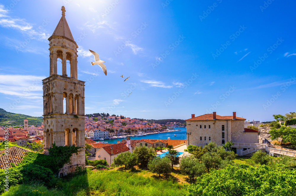 View at amazing archipelago in front of town Hvar, Croatia with seagull's flying over the city. Harbor of old Adriatic island town Hvar. Amazing Hvar city on Hvar island, Croatia.