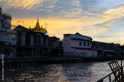 The golden mount in Wat Sraket Rajavaravihara temple at sunset light in Bangkok, Thailand photo