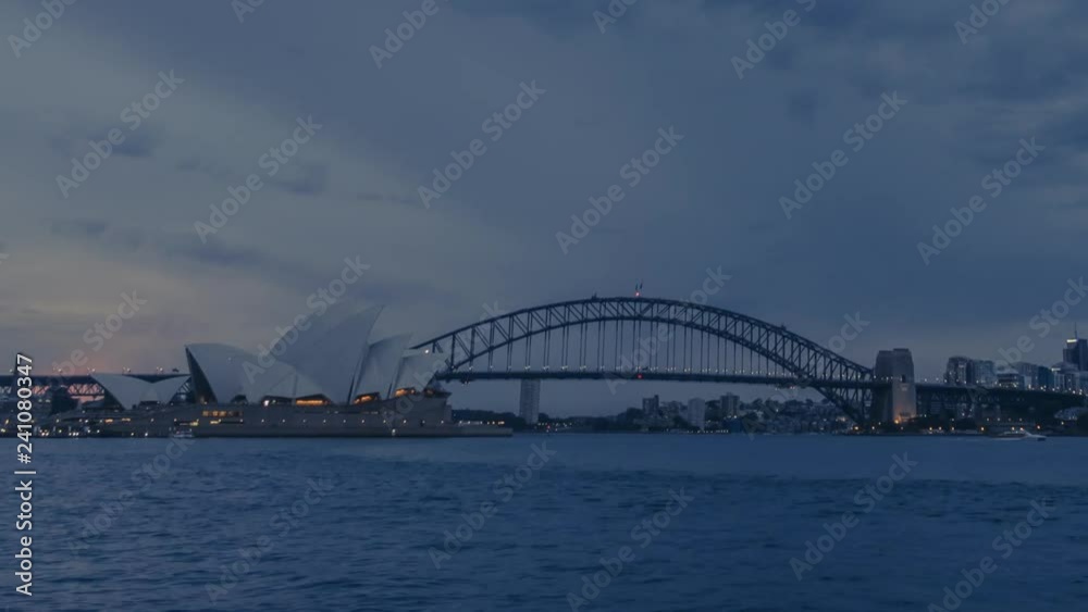 Day to night timelapse in Sydney, Australia with its most iconic building - Sydney Opera House and Sydney Harbour Bridge. Day to night timelapse in Sydney, Australia with its most iconic building - Sydney Opera House and Sydney Harbour Bridge.