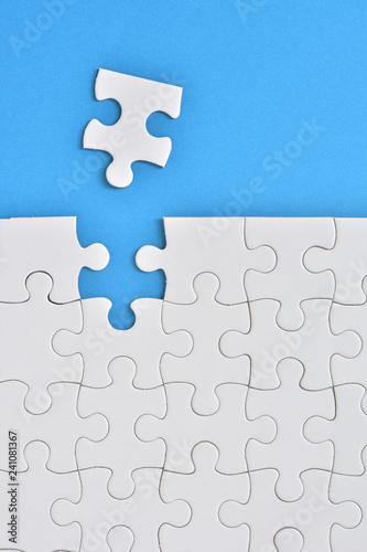 Jigsaw puzzle on a blue background