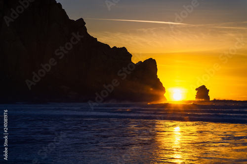 Silhouette of big rock in the water  sunset  Morro Bay  California