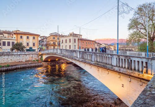 Rieti (Italy) - The historic center of the Sabina's provincial capital, under Mount Terminillo with snow and crossed by the river Velino, during the Christmas holidays