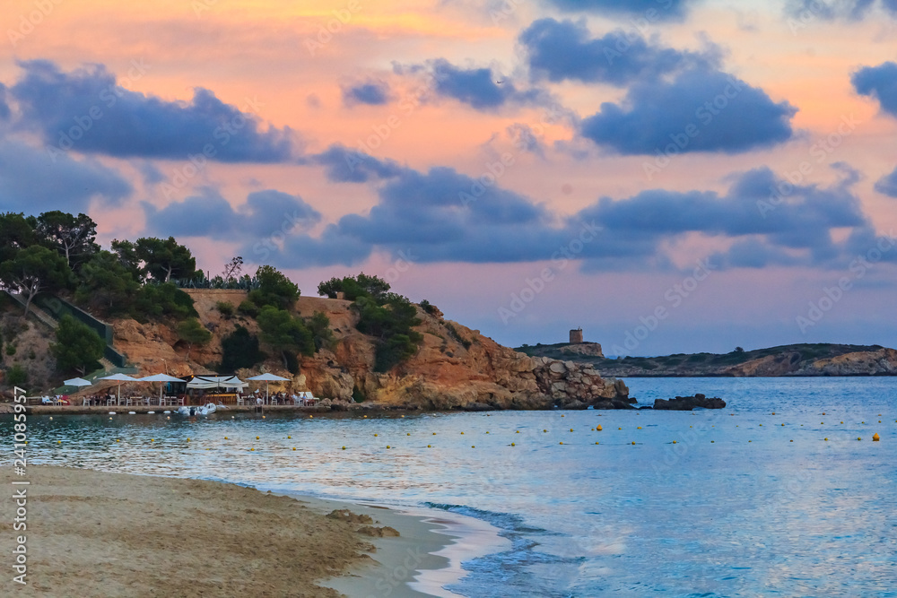 Sunset over a beach in Palma de Mallorca in Mallorca on Balearic islands in Spain