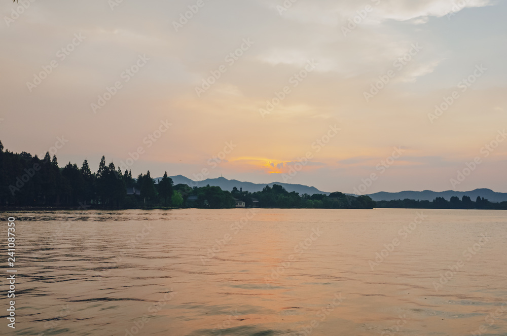 West Lake and hills under sunset, in Hangzhou, China