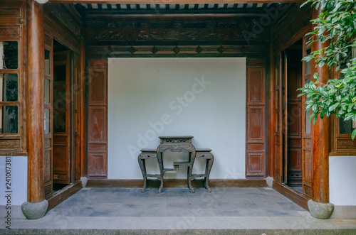 Entrance to a traditional Chinese house in a Chinese garden, near West Lake, Hangzhou, China photo