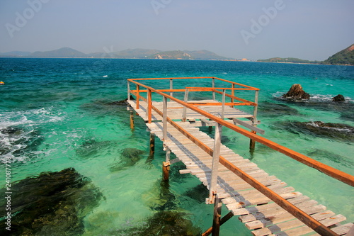 Koh kham small island and wood bridge on the beach with blue sky and clear water. Koh kham pattaya thailand. © Chaleow