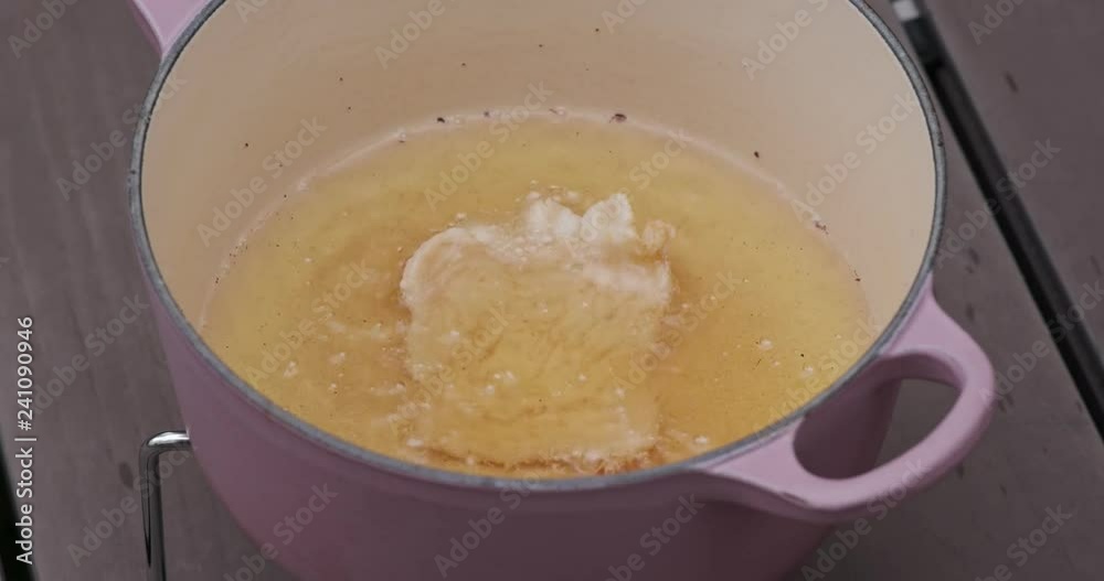 Cook prawn cracker in oil Cook prawn cracker in oil