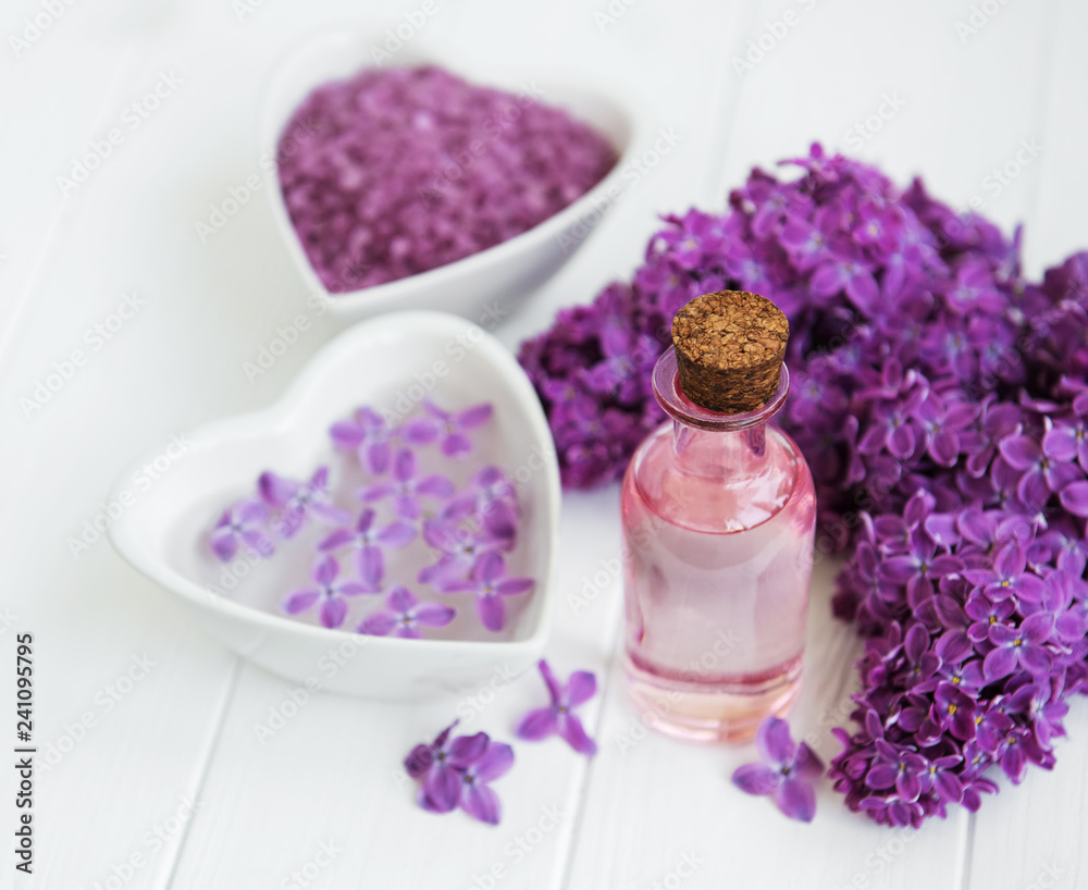 Essential oil with lilac flowers Essential oil with lilac flowers