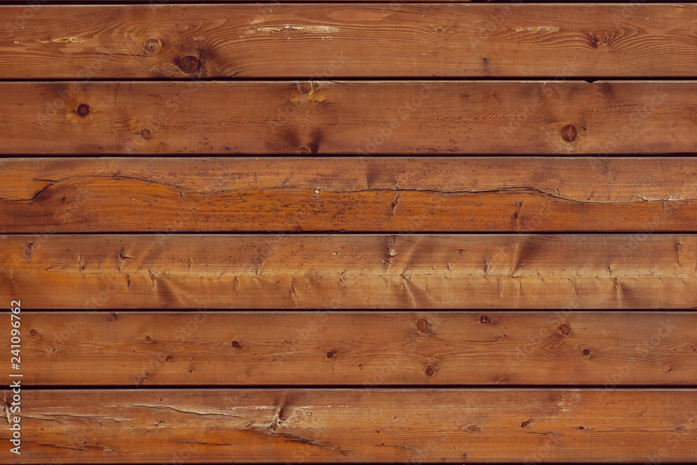 Wooden brown background is from lying horizontally boards Wall of wooden horizontal boards Wooden brown background is from lying horizontally boards Wall of wooden horizontal boards