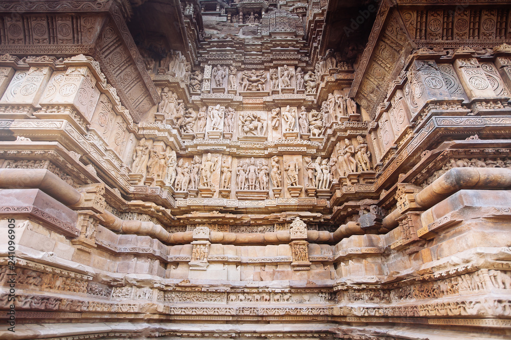 Ancient bas-relief at famous erotic temple in Khajuraho, India. Ancient bas-relief at famous erotic temple in Khajuraho, India.