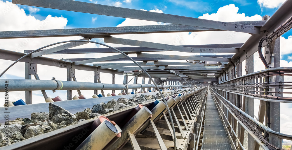 Fototapeta premium Platinum Mining and Processing of ore, Platinum rock being moved on a conveyor belt