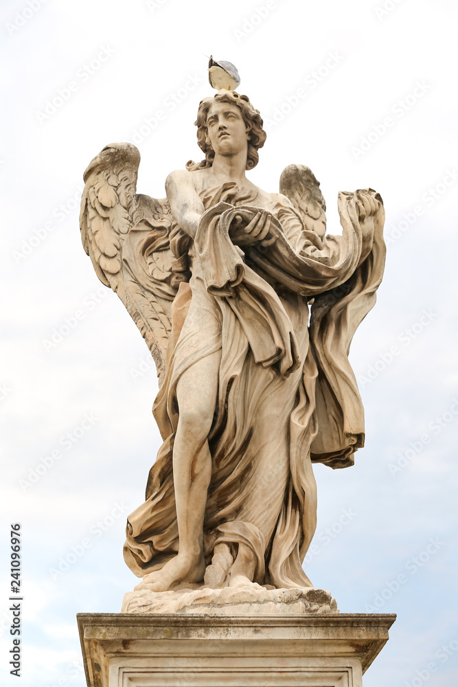 Angel with the Garment and Dice Statue in Hadrian Bridge, Rome, Italy