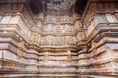 Ancient bas-relief at famous erotic temple in Khajuraho, India.