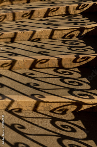 shadow pattern on the steps of a bridge over a canal in Venice