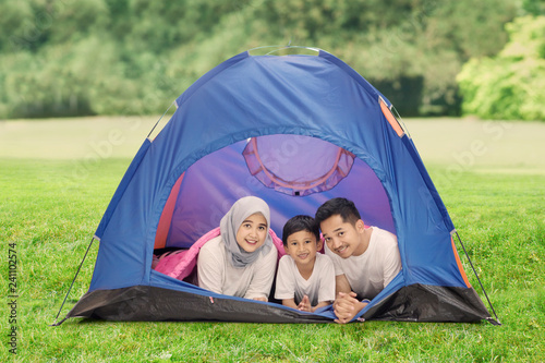 Muslim family lying together in the tent