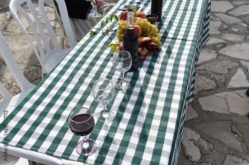 table filled with wine and grapes