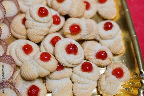Wallpaper Mural horizontal image with close detail of almond pastries with red cherry served on a tray Torontodigital.ca