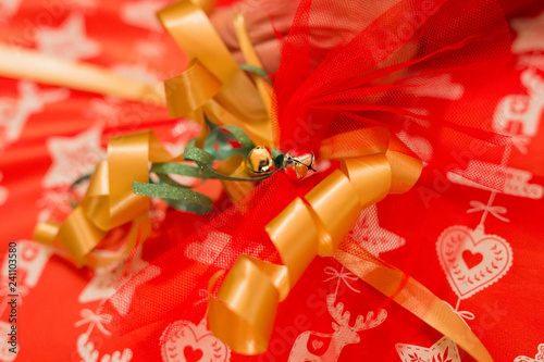 Wallpaper Mural horizontal image with a close-up detail of a golden little bell used to decorate a Christmas package Torontodigital.ca