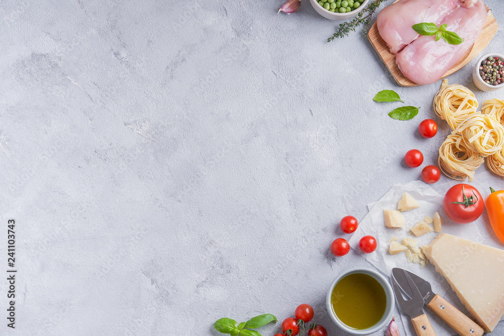 Italian food cooking ingredients. Pasta, vegetables, spices. Top view with copy space