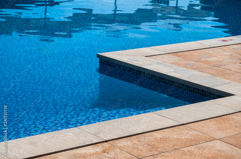 Detail of modern outdoor swimming pool in luxury hotel