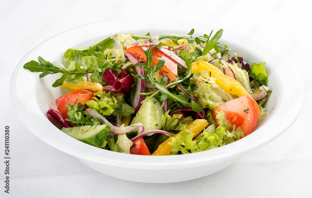 Fresh vegetable salad. On a white background Fresh vegetable salad. On a white background