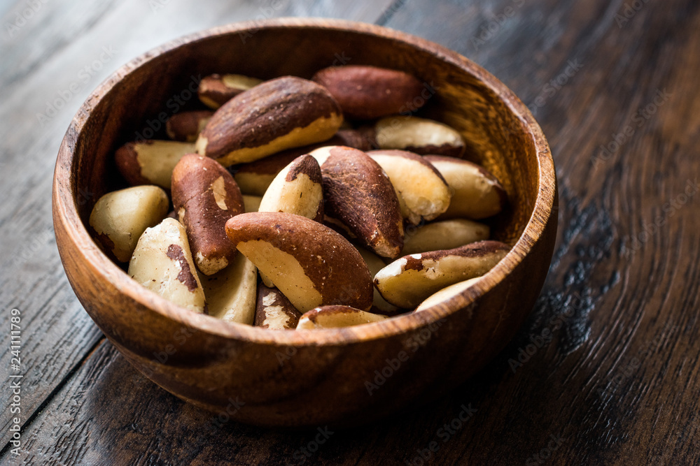 Brazil Nuts in Wooden Bowl without Shell Brazil Nuts in Wooden Bowl without Shell