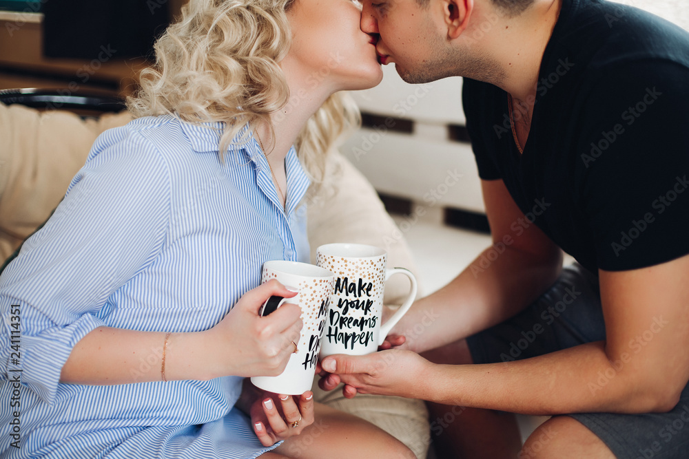 young sweet couple in love. Blonde girl 