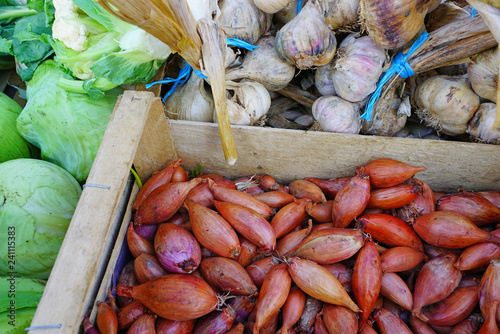 Fresh pink shallots at a French farmers market