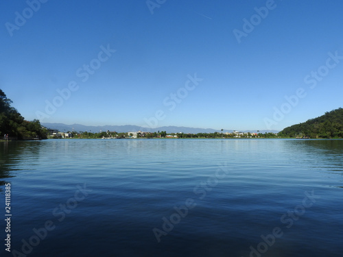 Plum Blossom Lake (Meihua Lake) located at Yilan county, Taiwan. Famous tourist spot for vacation. A natural reservoir.  Blue sky and lake , nature scenery. Feel relaxed and calm. Landscape background © ellens