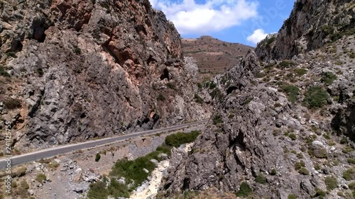 Cars driving through a canyon in crete (greece)