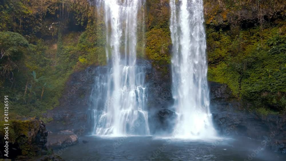 Beautiful waterfall hidden in the tropical jungles panorama handheld gimbal shot Beautiful waterfall hidden in the tropical jungles panorama handheld gimbal shot