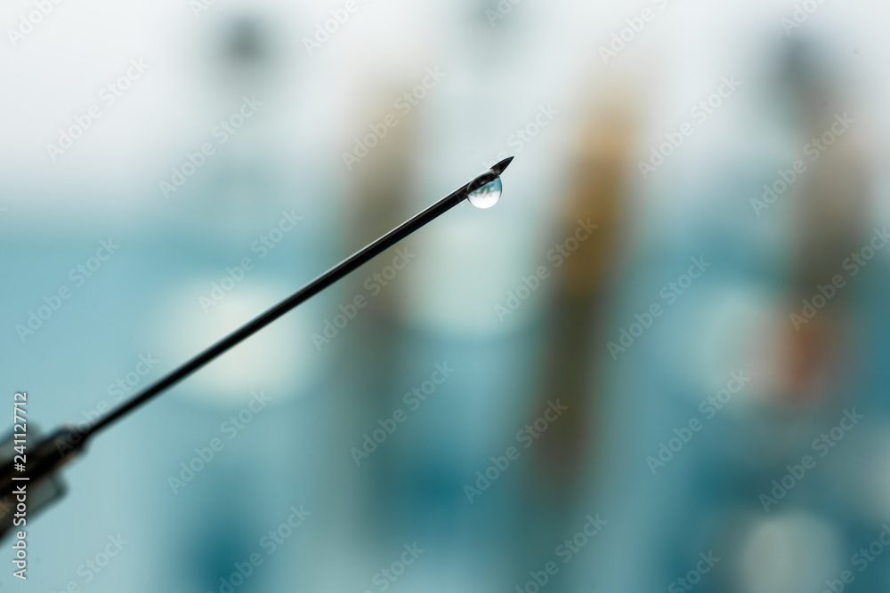 Close up Syringe needle medicine with liquid medicine drop Close up Syringe needle medicine with liquid medicine drop