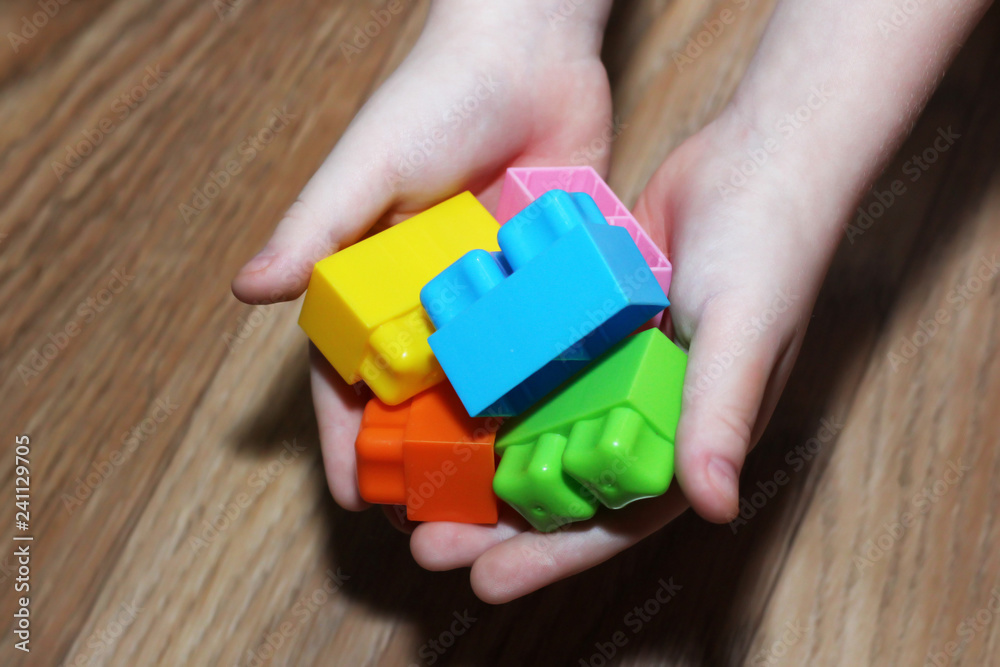 Colorful designer in children's hands Colorful designer in children's hands