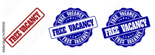 FREE VACANCY grunge stamp seals in red and blue colors. Vector FREE VACANCY signs with scratced surface. Graphic elements are rounded rectangles, rosettes, circles and text titles.