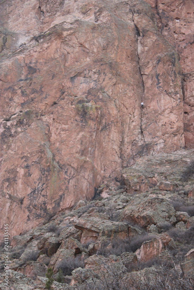 Climber on side of mountain Climber on side of mountain