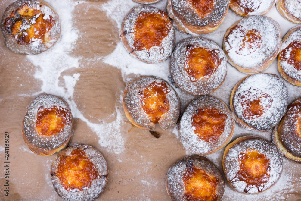 donut and powdered sugar on baking paper