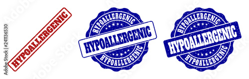HYPOALLERGENIC scratched stamp seals in red and blue colors. Vector HYPOALLERGENIC watermarks with scratced texture. Graphic elements are rounded rectangles, rosettes, circles and text titles.