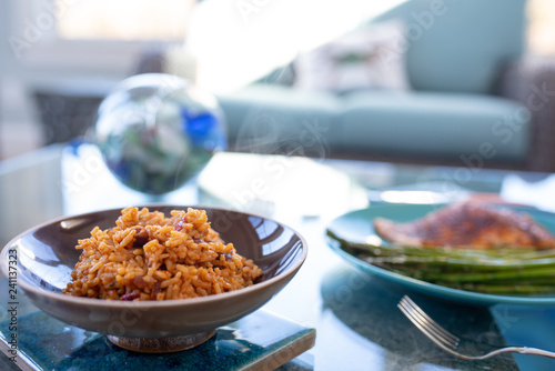 Healthy lunch or dinner meal with seasoned cooked salmon, asparagus stalks and Mexican rice