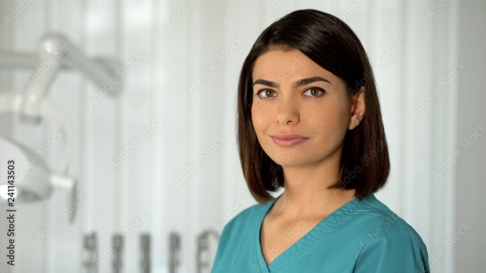 Lady doctor with charming smile posing for camera confidence and professionalism Lady doctor with charming smile posing for camera confidence and professionalism