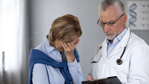 Fotografija Doctor showing unhappy woman bad test results, cancer treatment, oncology