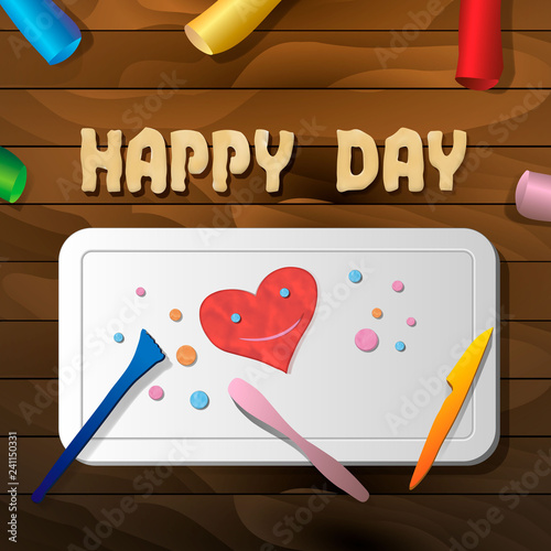 The product is a smiling heart of plasticine on the board for crafts on a wooden table, the text happy day and stacks. Clay effect