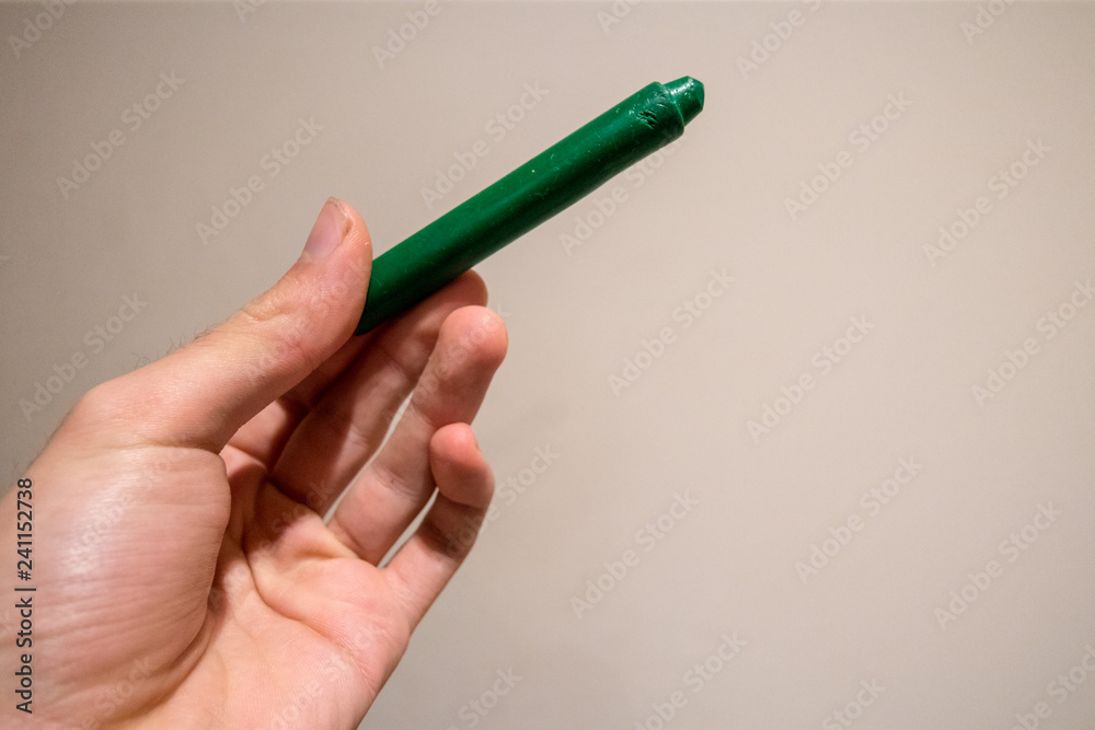 Dark Green Crayon in Hand Dark Green Crayon in Hand