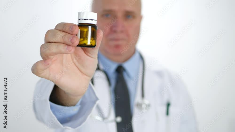 Confident Doctor Look to a Medical Recipient and Recommend Pills and Vitamins Confident Doctor Look to a Medical Recipient and Recommend Pills and Vitamins